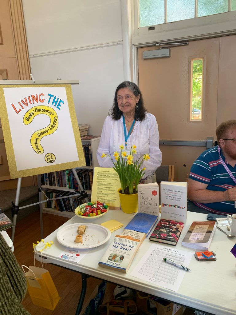 Living the Question: Books, Philosophy, Laughs, Growth, Spiritual, Why are We. Several books on the table.