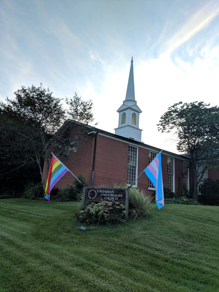 Pride Flags flying at UUCR sign