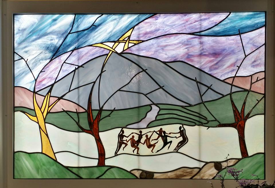 Stained Glass depicting volunteerism